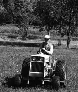 Mike on a riding mower